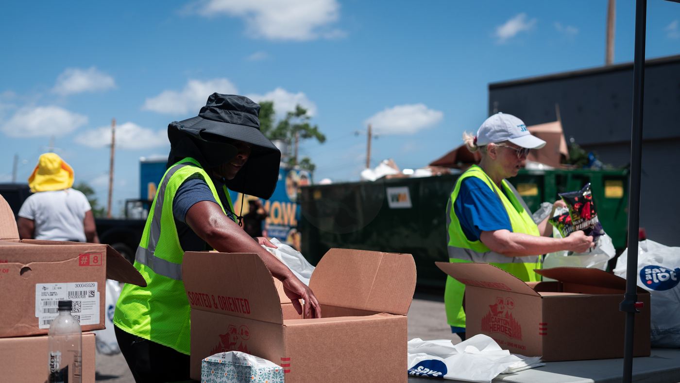 Volunteers packing boxes of supplies
