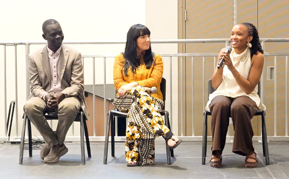 Florie smiling as she answers a question on the panel