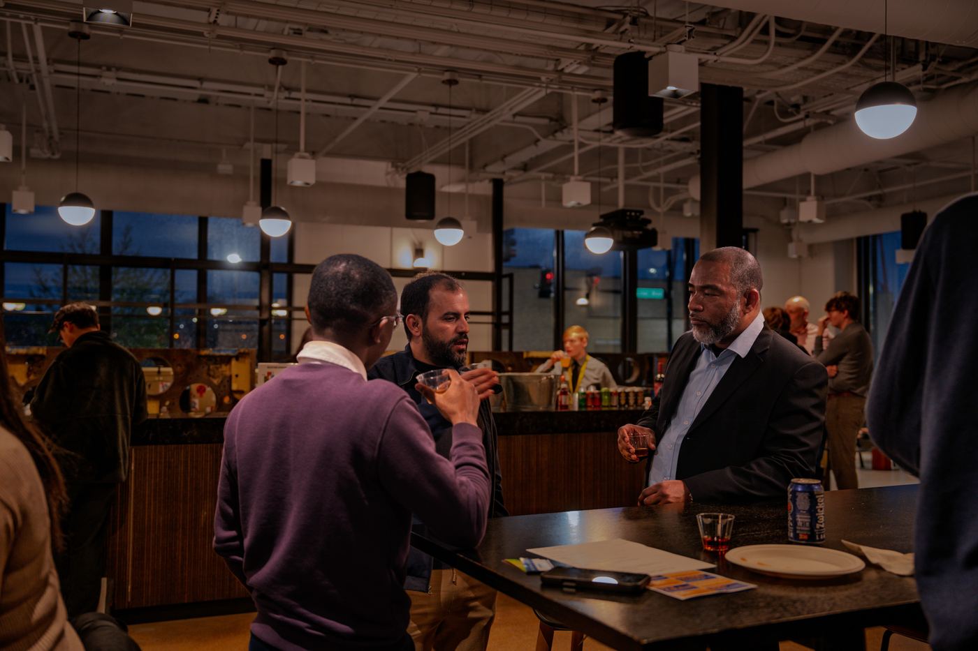 Attendees talking over drinks
